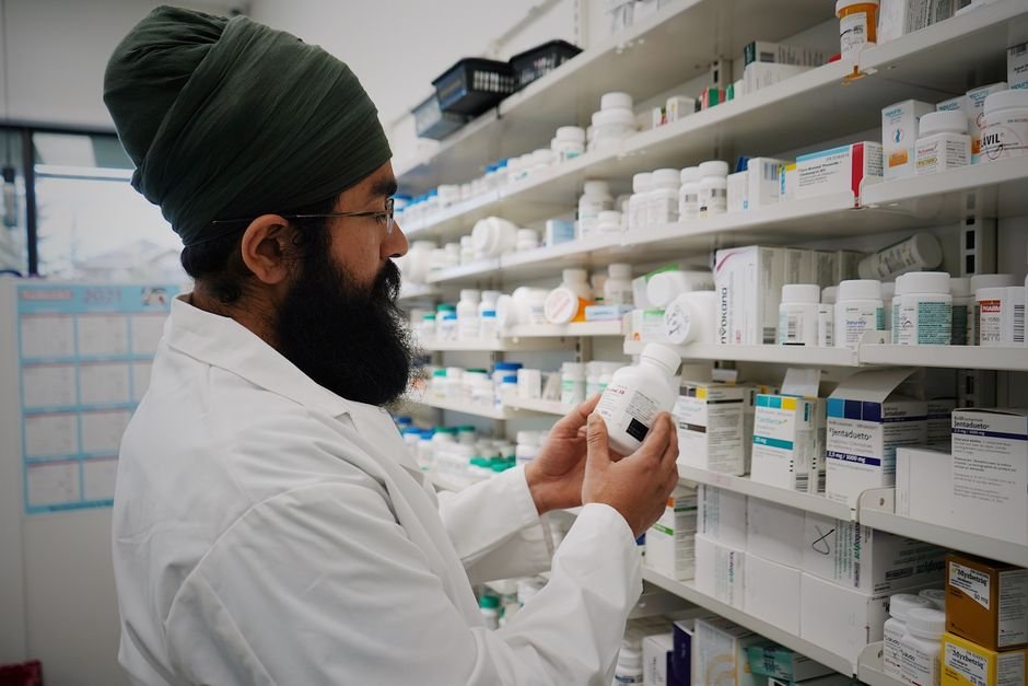 Pharmacy shelves stocked with medicines — Bangladesh pharma brands face high-volume, mixed-language social media engagement