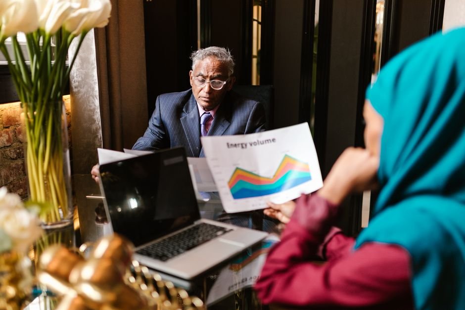 Executive analysing live business analytics on a laptop instead of waiting for static reports