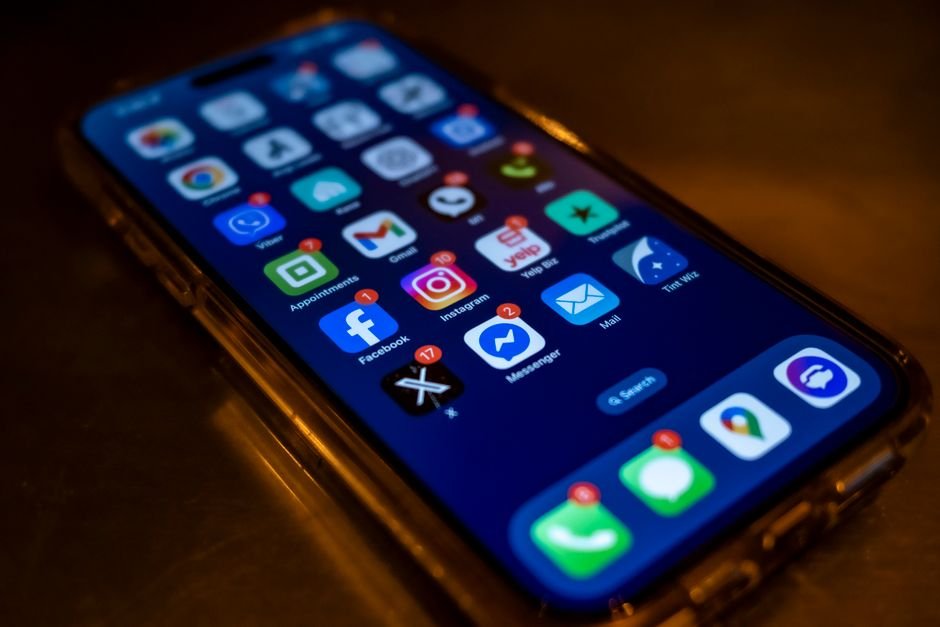 Person checking phone notifications at night โ off-hours social media monitoring