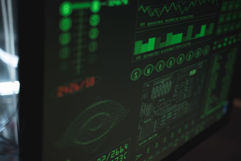 Team monitoring moderation dashboards on multiple screens in an operations room
