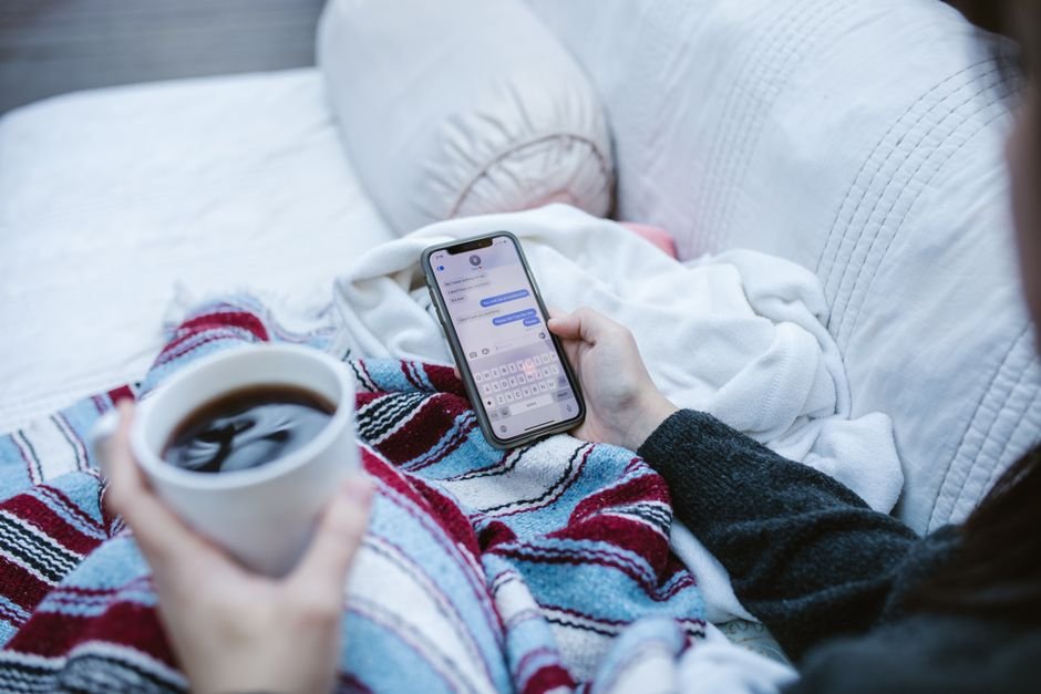 Social media chat bubbles on a phone screen — the mixed-language comment stream a moderation tool must handle