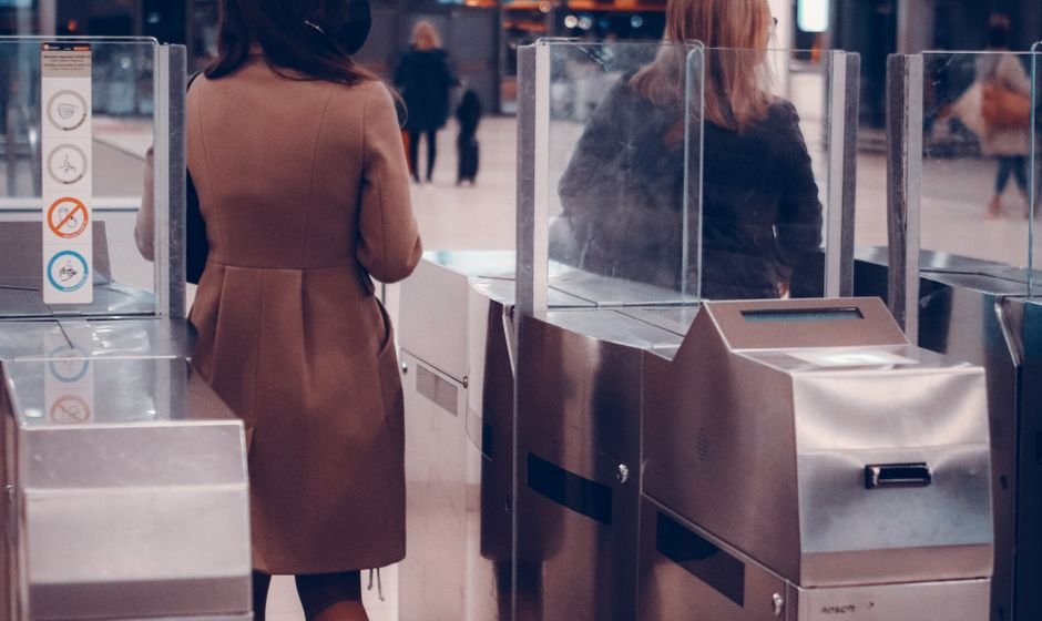 Passengers passing through access-control gates, illustrating that every database connection should be screened