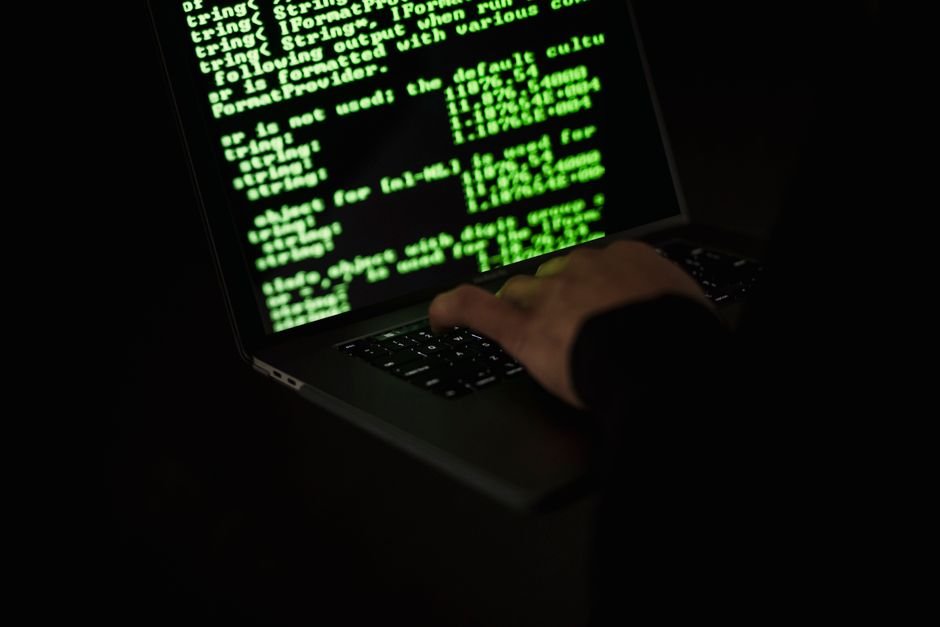 Attacker typing at a laptop in darkness - why prompt injection cannot be stopped by input filters alone
