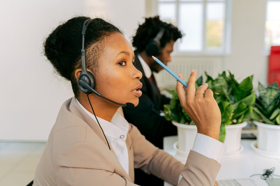 Customer service agent handling WhatsApp Business messages on a smartphone