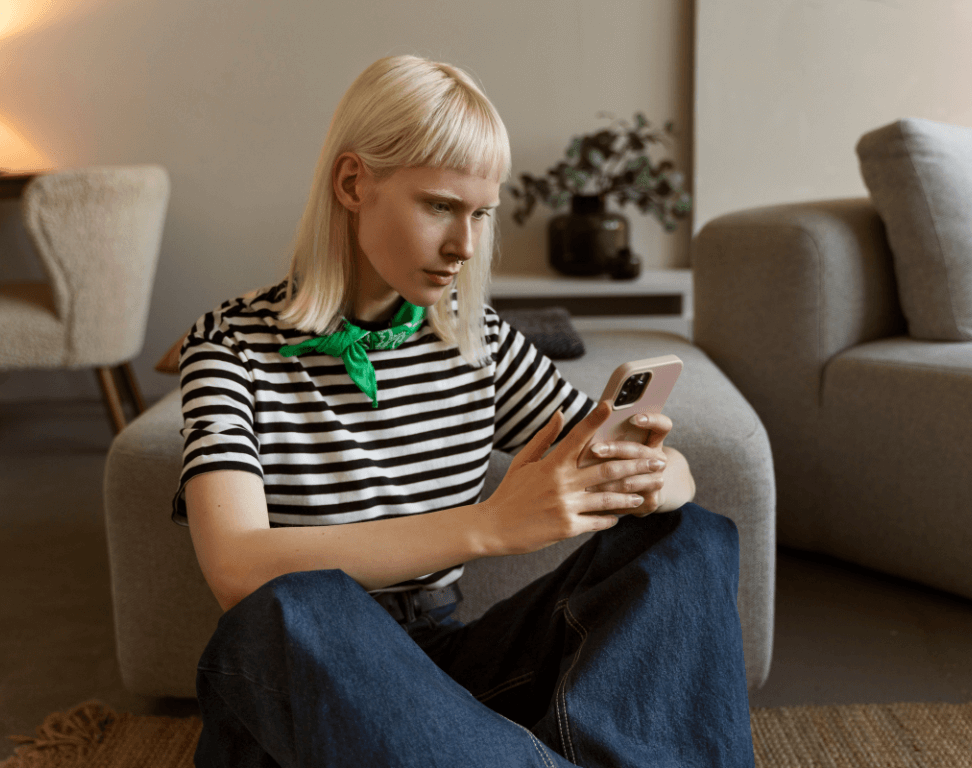 side-view-albino-woman-holding-smartphone